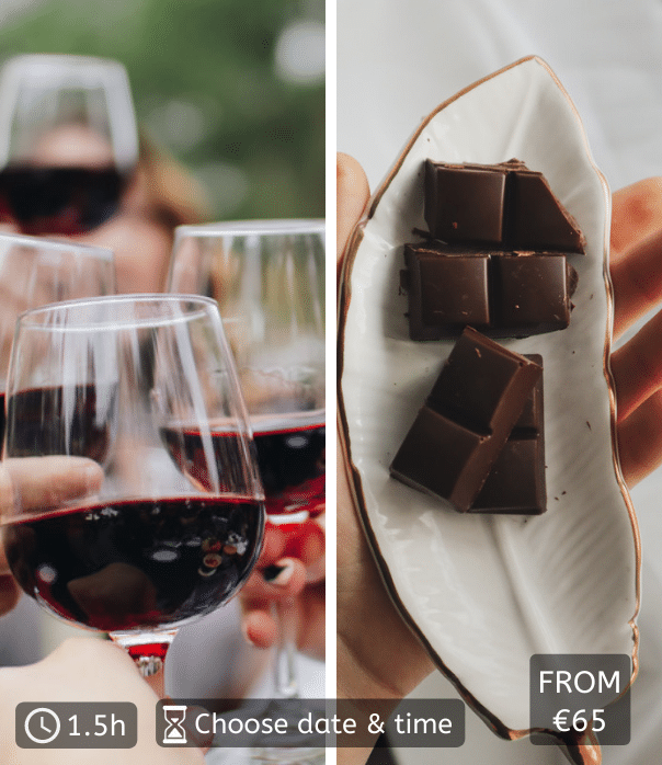 close up of red wine glasses clinking and chocolate